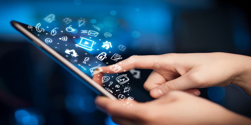 Finger tapping a tablet screen with glowing white app icons floating up out of it